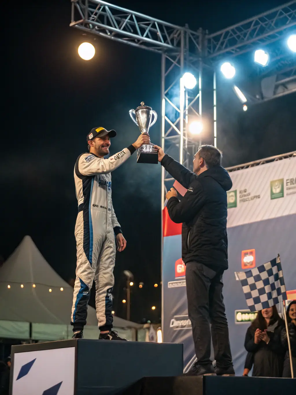 A professional shot of a driver receiving an award, highlighting the recognition and achievements of club members in the motorsport arena.